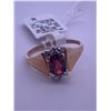 Image 1 : 10k yellow gold ring with garnet centre stone, and 6 melee diamonds; weighs 2.17 grams