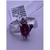 Image 1 : 10k white gold ring with a garnet centre stone, and melee diamonds; weighs 3.12 grams