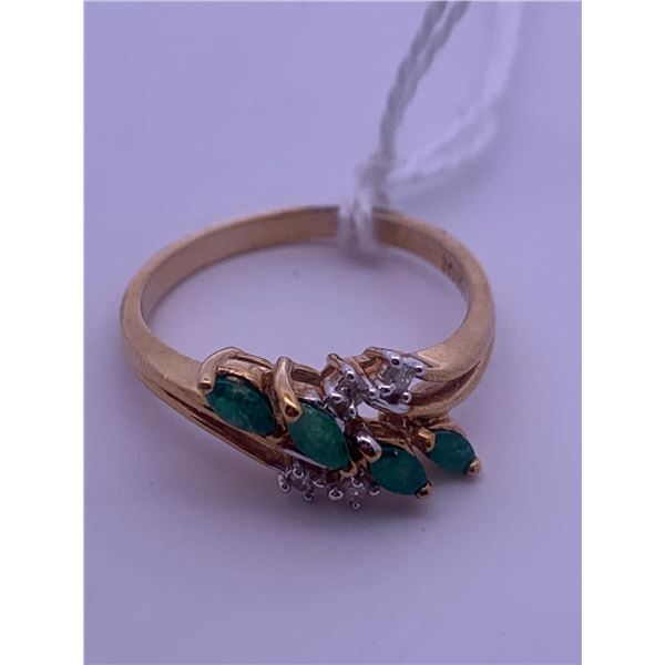 10k gold ring with 4 emeralds(?) and 4 melee diamonds; weighs 2.40 grams