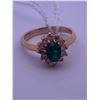 Image 1 : 10k yellow gold ring with an emerald(?) centre stone, and melee diamonds; weighs 2.47 grams