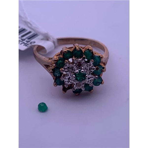 10k yellow gold ring with emerald, and melee diamonds; weighs 3.10 grams