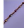 Image 2 : 10k yellow gold bracelet with multi colored stones; weighs 4.49 grams
