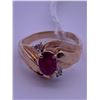Image 1 : 10k gold ring with a ruby(?) centre stone and 2 melee diamonds; weighs 3.24 grams