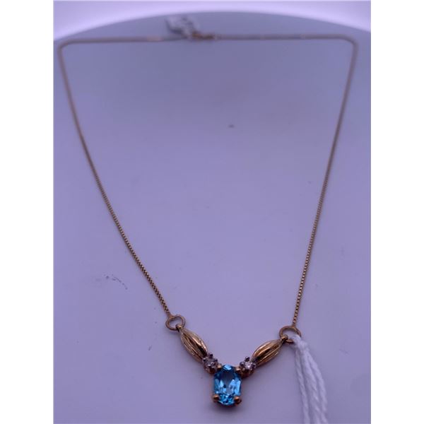 10k yellow gold necklace with blue topaz, and melee diamonds; weighs 2.43 grams