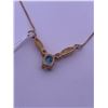 Image 2 : 10k yellow gold necklace with blue topaz, and melee diamonds; weighs 2.43 grams