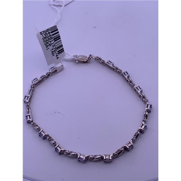 10k gold bracelet with tanzanite stones and melee diamonds; weighs 5.64 grams