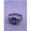 Image 1 : 10k white gold ring with a blue topaz(?) centre stone; weighs 3.31 grams