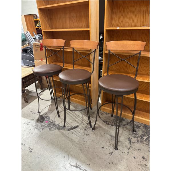 Three swivel barstools