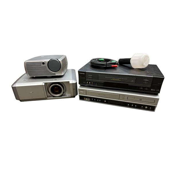 Box Of Assorted Electronics Vhs Players And Projectors , Sanyo, Toshiba, And Citizen