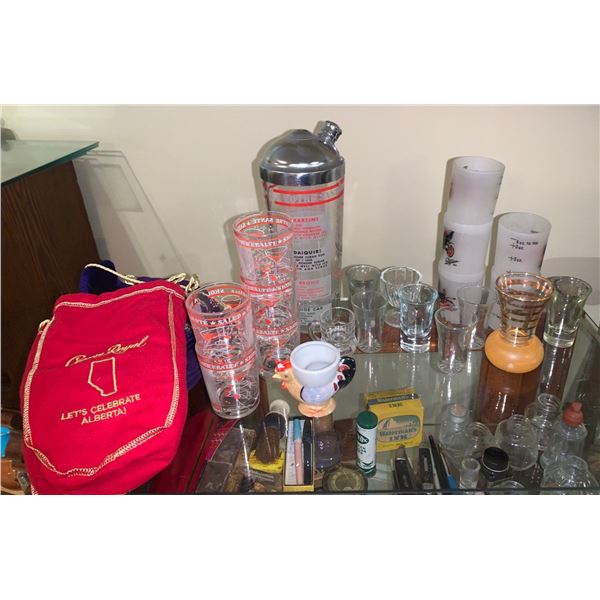 Set of shot glasses, with a mixer and crown royal baggies.