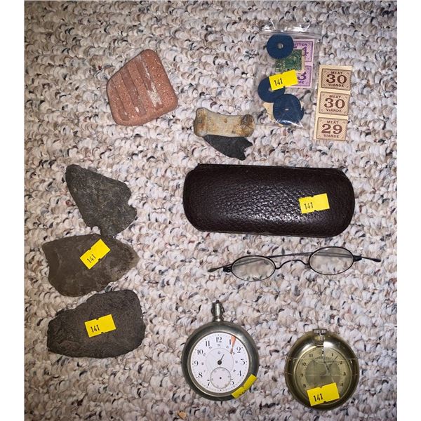 Antique glasses, stamps, pocket watches, and rocks