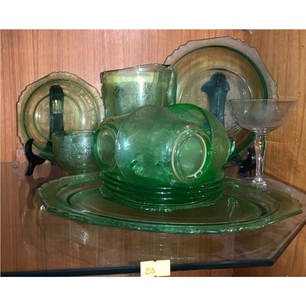 Set of green glassware; plates, cups, pitcher, etc