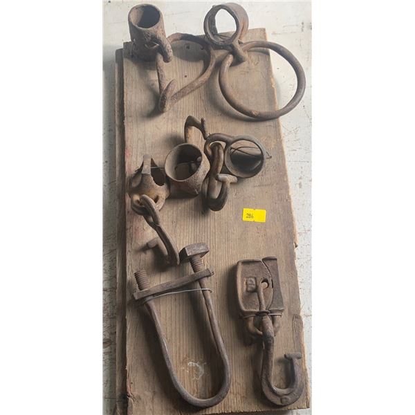 Set of antique tools attached to a wooden board