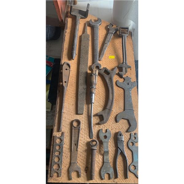 Set of antique tools attached to a wooden board