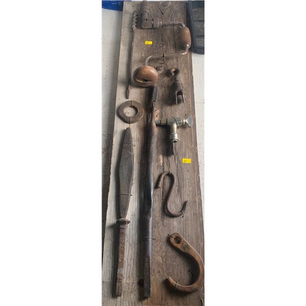 Set of antique tools attached to a wooden board