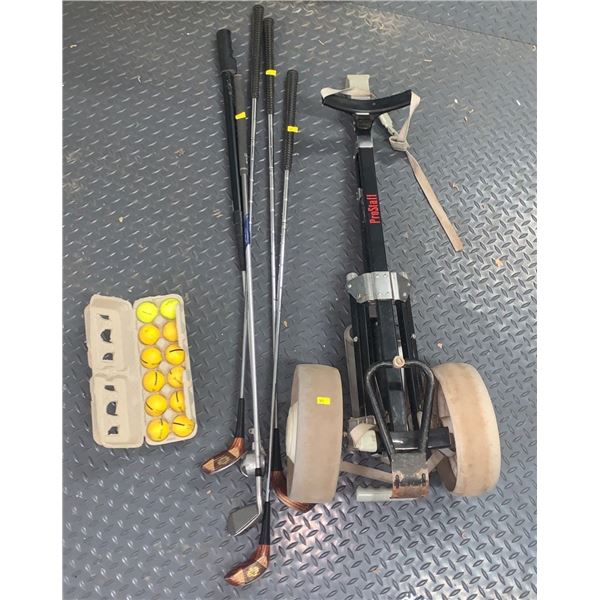 Set of golfing supplies including a Wilson push cart, 3 wooden Wilson 4200 golf clubs, golf balls