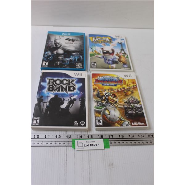 (4) Nintendo Wii Video Games: Batman Arkham City (Wii U), Rock Band, Skylanders Super Chargers, Raym