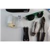 Image 2 : (2) Multi Tools, Pliers, Welders Goggles, Garmin Navigator, Benchmark Retract-A-Bit and Assorted Ite