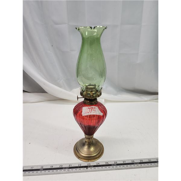 Red painted coal oil lamp, w/ green chimney
