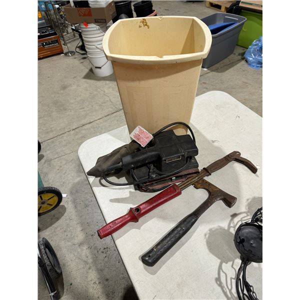 Assorted tools and garbage can
