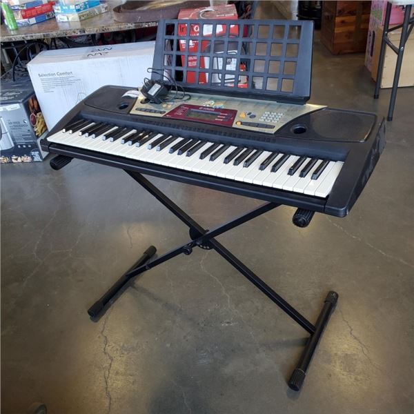YAMAHA ELECTRIC KEYBOARD WITH STAND AND CHARGER
