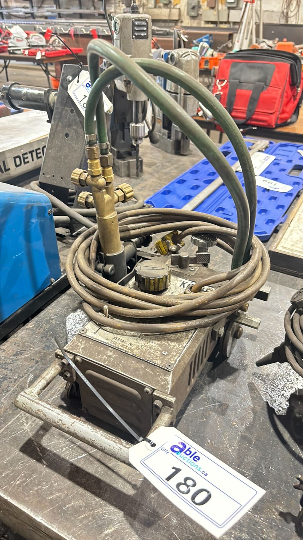 KOIKE IK-12 TRACK CUTTER WITH 2 SECTIONS OF TRACK - Able Auctions