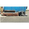 Image 1 : 4 PALLETS OF MISCELLANEOUS - TIRES, PALLET RACKING SIDE RAILS, TRUCK STORAGE TAILGATE AND BOARDS