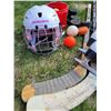 Image 2 : Winter sports lot. Figure skates, helmet, wood hockey sticks & street hockey soft pucks.