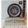 Image 1 : Unique rolling tire alarm clock. Shifting sound & says Good morning when stopped.
