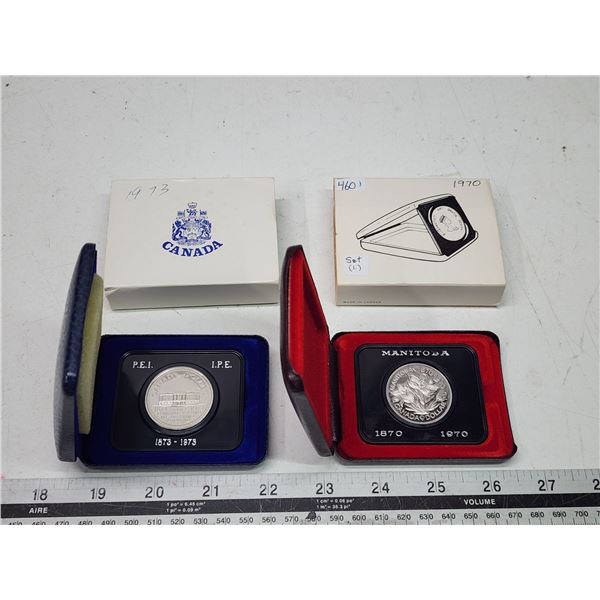 Pair of Canadian nickel dollars, in cases - 1970 & 1973