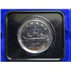 Image 2 : 1975 Canadian Nickel Dollar. Specimen. Housed in its original blue clamshell case. Bright White.