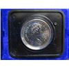 Image 3 : 1975 Canadian Nickel Dollar. Specimen. Housed in its original blue clamshell case. Bright White.