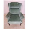 Image 1 : Green upholstered reclining arm chair