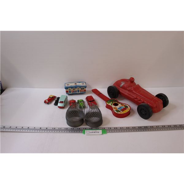 (6) Die Cast Cars, Slinky, (1) Trailer Car , Toy Guitar, Red Plastic Hot Rod Car
