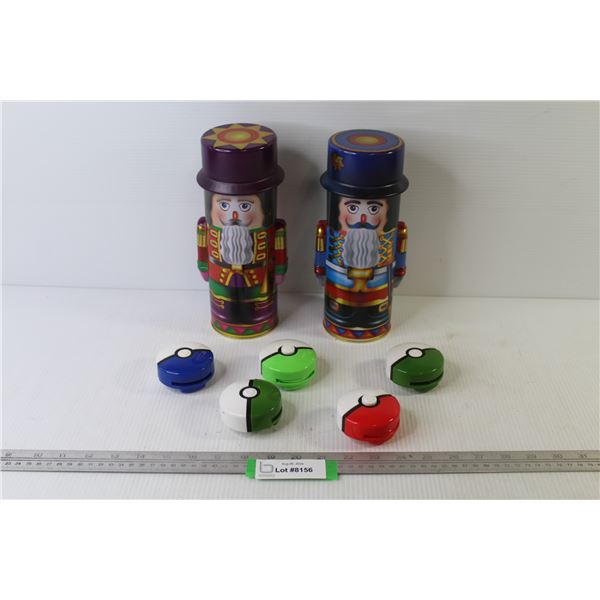 (2) Nut Cracker Tin Containers - (5) Pokemon Disk Shooters (3 missing disks)