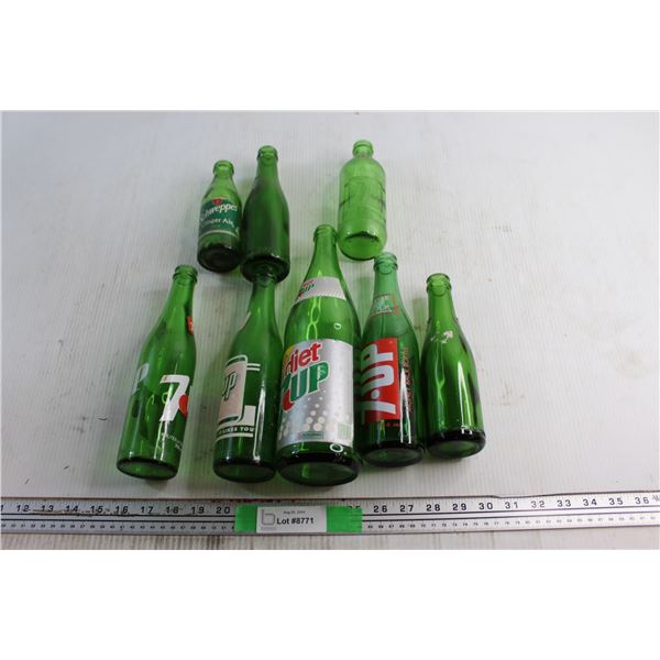 (8) Assorted Schweppes and 7Up Glass Bottles