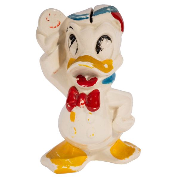 A Donald Duck Ceramic Coin Bank.