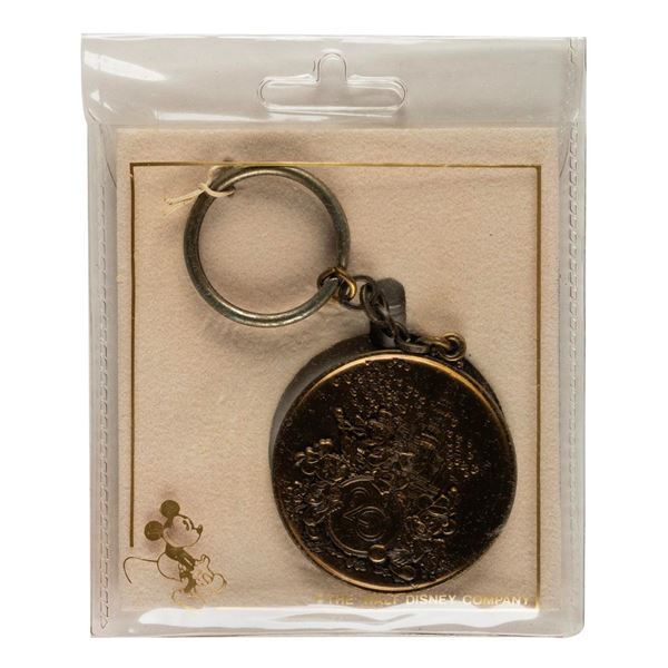 A Walt Disney World 20 Magical Years Keychain.