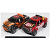 Image 1 : TWO FORD RAPTOR PARTY ROCK TOY TRUCKS
