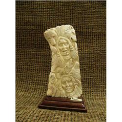 Fossilized ivory with relief carved men surrounded by animals (2)