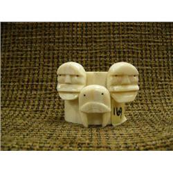 Mark Seeganna 3 ivory masks with baleen inset eyes mounted on ivory (2)