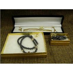 Lot of jewelry: Hematite necklace and bracelet and 4 gold colored bracelets (225)