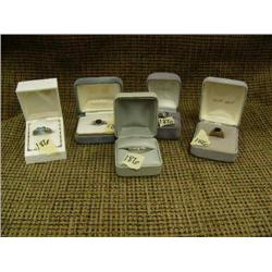 Lot of 5 rings: black stone ring, pale yellow stone ring, light blue stone ring, 2 garnet colored ri