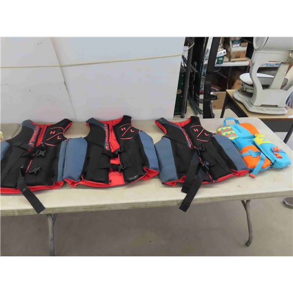 4 Life Floatation Devices Sizes: (1) Medium, (2) XL, (1) Child 