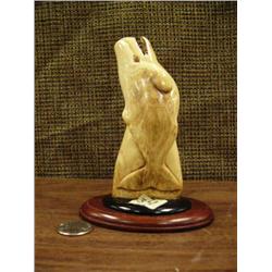 Fossilized whale tooth carved whale on wood base (223)