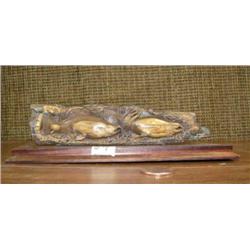 Fossilized mammoth bark relief carved with salmon (2)