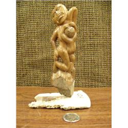 Bone carving of mother feeding child on ivory base by Evak (2)