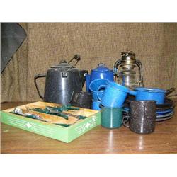 Lot of camping kitchen items: plated, mugs, coffee pots, silverware and kerosene lamp (2)
