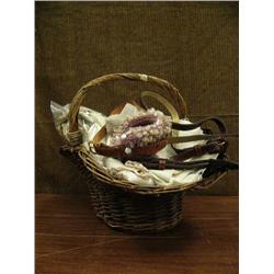 Basket of old linens, gloves and 3 wood balls (2)