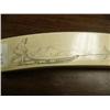 Image 5 : Ivory scrimshawed tusk on all four sides: walrus, polar bear face, seal, mukluk, mitten, seal, tool,